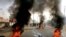 Sudanese protesters use burning tires to erect a barricade on a street, demanding that the country's Transitional Military Council hand over power to civilians, in Khartoum, Sudan, June 3, 2019.