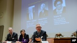 Jan Andersson, Juleen Zierath and Hans Forssberg, members of the Karolinska Institute Nobel committee, talk to media at a press conference in Stockholm, Oct. 5, 2015. 