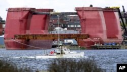 FILE - A section of a giant oil rig is docked after arriving at the Portland Ocean Terminal in Portland, Maine, April 26, 2002. The controversy over drilling for oil in the Atlantic Ocean was reignited by the election of Donald Trump as president. 