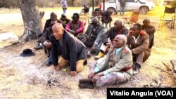 Elders light a fire at a border post in eastern Namibia.