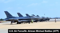 FILE - Six U.S. F-16 Fighting Falcons from Aviano Air Base, Italy, arrive at Incirlik Air Base, Turkey, to take part in anti-Islamic State missions, Aug. 9, 2015.
