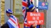 FILE - Anti-Brexit protesters stand outside the International Convention Center in Birmingham during a Conservative Party Conference at the ICC, in Birmingham, England, Oct. 2, 2018.