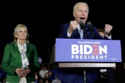 Democratic presidential candidate former Vice President Joe Biden, accompanied by his wife Jill, speaks during a primary election night rally Tuesday, March 3, 2020, in Los Angeles. (AP Photo/Marcio Jose Sanchez)