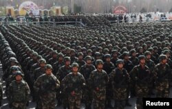 Paramilitary policemen stand in formation as they take part in an anti-terrorism oath-taking rally, in Kashgar, Xinjiang Uighur Autonomous Region, China, Feb. 27, 2017.