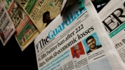 FILE - Newspapers are seen on display after Nigeria's government announced the lifting of a Twitter ban, in Abuja, Nigeria, Jan. 13, 2022.