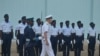 U.S. Navy Admiral James Foggo, in Ghana to participate in a conference on international maritime defense, inspects Navy personnel. (Stacey Knott for VOA)