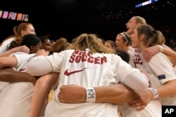 Stanford basketball players wear the letters KM on their wrists in honor of Katie Meyer, a soccer player who died from suicide earlier this year. (AP Photo/David Becker, File)