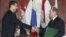 In this Jan. 25, 2005 file photo, Syrian President Bashar Assad, left, and Russian President Vladimir Putin shake hands during a signing ceremony in the Kremlin, Moscow.