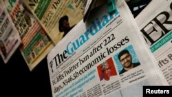 FILE - Newspapers are seen on display after Nigeria's government announced the lifting of a Twitter ban, in Abuja, Nigeria, Jan. 13, 2022. 