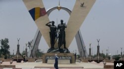 FILE - A man walks past "Place de la Nation" park in N'Djamena, Chad, April 26, 2021.
