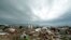Storm clouds build in the distance beyond tornado-ravaged homes in Moore, Oklahoma, May 21, 2013. 