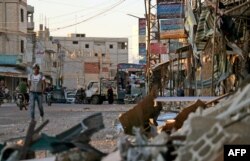 Damage caused by regime airstrikes is seen in the rebel-held town of Nawa in southern Syria, July 17, 2018.