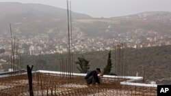 A worker is seen at a construction site in the Jewish settlement of Shilo, March 3, 2014. Prime Minister Benjamin Netanyahu announced March 30, 2017, plans to build a new West Bank settlement in an area called Emek Shilo. 