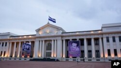 FILE - Pro-government posters cover the National Palace on Revolution Square in Managua, Nicaragua, Aug. 1, 2018. 