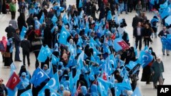 People from the Uighur community living in Turkey carry flags of what ethnic Uighurs call 'East Turkestan', during a protest in Istanbul, Tuesday, Nov. 6, 2018, against what they allege is oppression by the Chinese government to Muslim Uighurs in far-western Xinjiang province. 