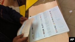 Ballots are readied on the second day of voting in Egypt's landmark parliamentary elections. Symbols make it easier for voters to recognize candidates, November 28, 2011 (file photo).