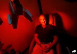 Ric Rooney sits in a newly installed room in his updated tanning salon northeast of downtown Colorado Springs, Colo., March 22, 2017. Former President Barack Obama's Affordable Care Act imposed a 10 percent tax on tanning as a way to help fund provisions of the law that expanded coverage for 20 million Americans.