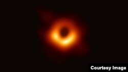 An image of the black hole at the center of Messier 87, a massive galaxy in the nearby Virgo galaxy cluster. This black hole resides 55 million light-years from Earth and has a mass 6.5-billion times that of the Sun.