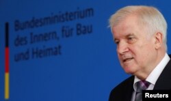FILE - German Interior Minister Horst Seehofer speaks at a news conference in Berlin, Germany, June 20, 2018.