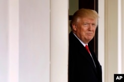 President Donald Trump awaits the arrival of Iraqi Prime Minister Haider al-Abadi at the White House in Washington, March 20, 2017.
