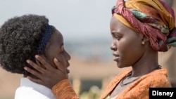 Madina Nalwanga (left) and Lupita Nyong’o in the new film 'Queen of Katwe.'