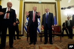 President Donald Trump talks to reporters before a meeting with Israeli Prime Minister Benjamin Netanyahu, May 22, 2017, in Jerusalem.