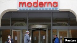 FILE - A sign marks the headquarters of Moderna which is developing a vaccine against the coronavirus, in Cambridge, Massachusetts, U.S., May 18, 2020. The company now has four people on the 2021 Forbes billionaires list. (REUTERS/Brian Snyder/File Photo)