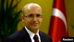 FILE - Turkish Deputy Prime Minister Mehmet Simsek is in Ankara, Dec. 23, 2015.