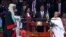 Kenyan President Uhuru Kenyatta, center, is sworn in as his wife, Margaret, right, looks on during his inauguration at Kasarani Stadium in Nairobi, Kenya, Nov. 28, 2017. 