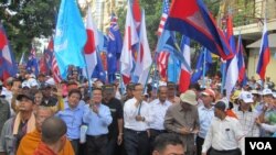 Thousands gathered early Wednesday in Phnom Penh’s Freedom Park, where they were met by thousands of riot police.