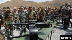 Major General Zhang Jian, commander of the Chinese People's Liberation Army Southern Theatre Command, and Pol Saroeun, commander-in-chief of the Cambodian military, attend the opening of military exercise in Kampong Speu province, Cambodia, March 17, 2018