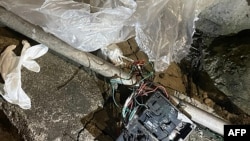 This handout photo taken by the South Korean Defense Ministry between the night of May 28 and 29, 2024, and released on May 29 shows unidentified objects in the yard of a house in Seoul.