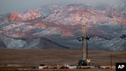 FILE - A drill rig stands at a Fervo Energy geothermal site under construction near Milford, Utah, Sunday, Nov. 26, 2023. In Nevada, Fervo’s first operational project has begun sending electricity to the state's grid to power Google data centers. (AP Photo/Ellen Schmidt)