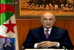 FILE - A video grab from Algeria 3 public channel shows Algerian President Abdelmadjid Tebboune giving a televised speech in Algiers, Feb. 18, 2021.