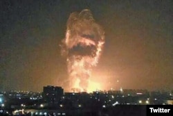 A social media image purportedly shows flames and smoke from an explosion rising into the night sky in Tianjin, China.