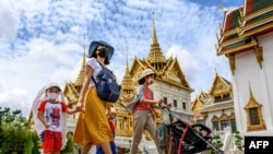 People visit the Grand Palace in Bangkok on June 7, 2020, as it reopened for visitors following restrictions to halt the spread of the COVID-19.
