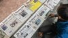 FILE - A vendor arranges newspapers in Siliguri, India, Jan. 21, 2021.