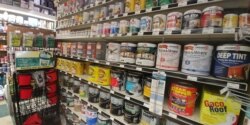 Many hardware store customers are purchasing paint for do-it-yourself home projects. (D.Block/VOA)