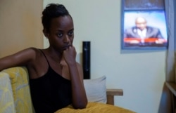 A resident watches a television broadcasting the death of President Pierre Nkurunziza in Bujumbura, Burundi, June 9, 2020. His sudden death came as a shock to everyone on the African political scene.