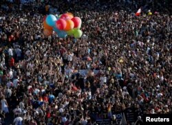 Hundreds of thousands of people attend the World Pride parade in Madrid, Spain, July 1, 2017. The 10-day festival highlighting gay rights ends Sunday.
