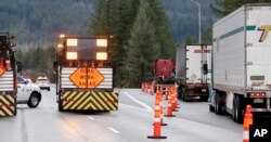 Traffic is diverted off eastbound Interstate 90 before Snoqualmie Pass in North Bend, Wash., Jan. 18, 2017. An ice storm shut down parts of major highways and interstates in Oregon and Washington state and paralyzed some towns along the Columbia River Gorge, with up to 2 inches of ice coating the ground in some places.