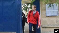 Russian opposition activist Alexei Navalny leaves a detention center in Moscow, Russia, June 14, 2018.