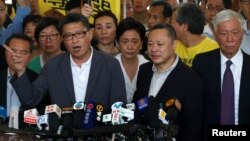 Occupy Central pro-democracy movement founders Chan Kin-man, Benny Tai and Chu Yiu-ming arrive at the court for sentencing on their involvement in the Occupy Central, also known as "Umbrella Movement," in Hong Kong, China, April 24, 2019.