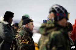 Vietnam Army veteran Dan Luker of Boston attends a briefing for fellow veterans at the Oceti Sakowin camp where people have gathered to protest the Dakota Access oil pipeline in Cannon Ball, N.D., Dec. 3, 2016.
