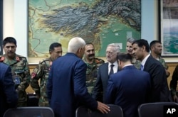 FILE - U.S. Defense Secretary James Mattis, meets with the defense minister and other members of the Afghan delegation at Resolute Support headquarters, in Kabul Afghanistan, April 24, 2017.