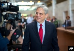 FILE - Judge Merrick Garland, President Barack Obama's choice to replace the late Justice Antonin Scalia on the Supreme Court arrives at Capitol Hill in Washington, April 13, 2016.