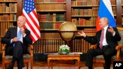 FILE - U.S. President Joe Biden, left, and Russia's President Vladimir Putin meet for the U.S.-Russia summit at Villa La Grange in Geneva, Switzerland, June 16, 2021. 