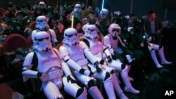 Chinese fans, some dressing as Star Wars characters' costumes, wait for the premiere of "Star Wars: The Force Awakens" in Shanghai, China, Dec. 27, 2015.