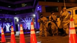 National Guard personnel and police secure a street near the Capitol, Sunday, Jan. 17, 2021, in Washington, as part of increased security ahead of the inauguration of President-elect Joe Biden and Vice President-elect Kamala Harris. (AP Photo…