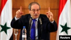 Syria's Foreign Minister Faisal al-Miqdad arrives in Cairo, April 1, 2023, in the first visit by a top Syrian official in more than 14 years to the Egyptian capital.